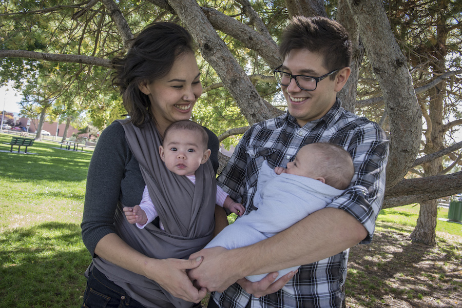 Family outside with newborns