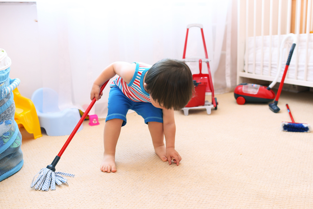 baby cleaning his room